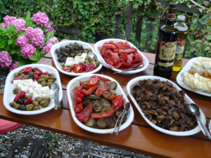 Photo of al fresco appetizers like olives and cheese