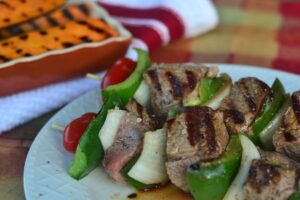 meat skewers and grilled vegetables