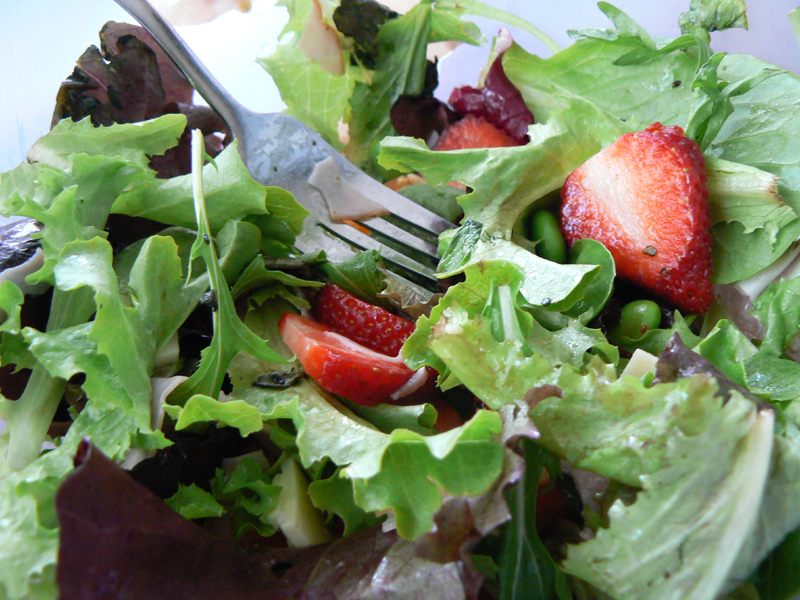 photo of a green salad with berries