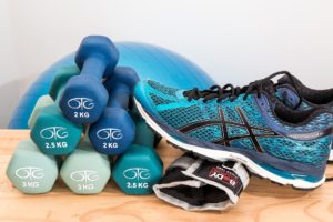 Photo of running shoes and hand weights