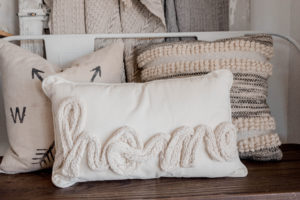 photo of a pillow that says HOME