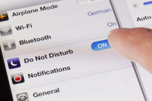 photo of a mobile phone being switched to do not disturb