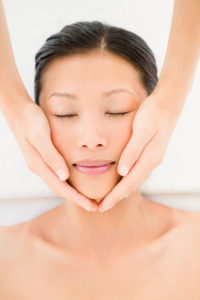 A lady getting a facial massage