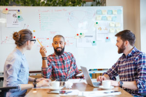 3 people in a meeting