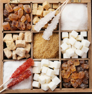 Different types of sugar in a wooden box