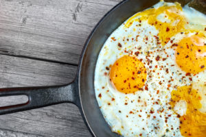 Keto Fried eggs in cast iron frying pan