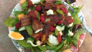 Salad with hard cooked egg and bacon