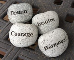 Rocks with Dream Inspire Courage Harmony written on them