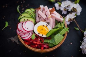 Salad with ham, cucumber, spinach, Bulgarian pepper.
